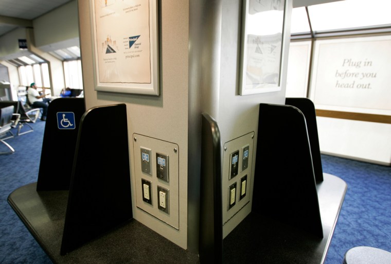 A charging kiosk is shown in Terminal B at Dallas-Fort Worth International Airport in Grapevine, Texas. Usually stationed near a Starbucks Corp. coffee shop, the kiosks include benches and banks of outlets, USB charging ports and ethernet plugs that tap into the facility's free Internet connection.