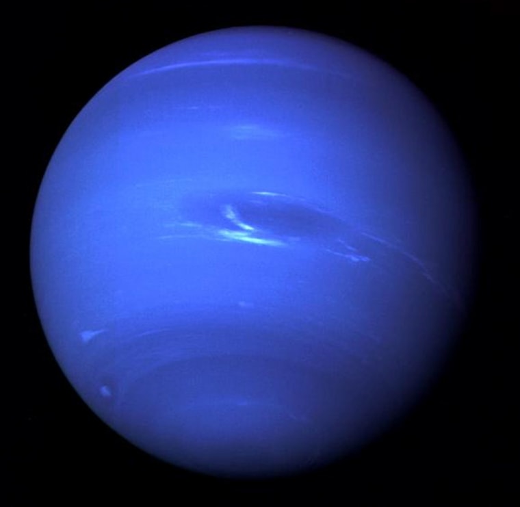 This picture of Neptune was taken by Voyager 2 and shows the Great Dark Spot, an Earth-size storm system.