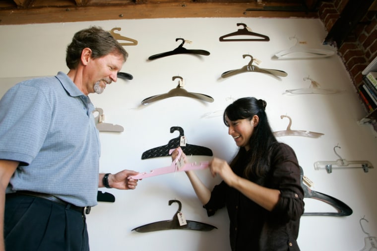 John Stayton, left, the Dominican College Green MBA program director, looks over hanger designs with Miya Kitahara, a business administrator at GreenHeart Global, a sustainable product design and manufacturing company in Oakland, Calif.