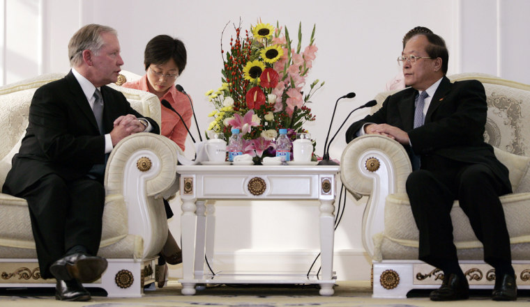 Thomas Debrowski, Mattel's executive vice president of worldwide operations (L) hold talks with Li Changjiang (R), head of China's top agency in charge of supervising product quality in Beijing, 21 September 2007. A senior executive with US toy giant Mattel apologised 21 September to China over massive recalls of products made in China, saying the cause was design flaws committed by the US company itself. AFP PHOTO/Peter PARKS (Photo credit should read PETER PARKS/AFP/Getty Images)