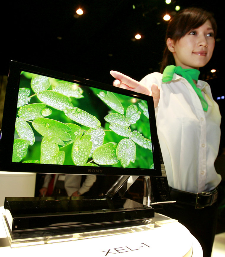 A model displays the world's first OLED TV "XEL-1" at Sony's headquarters in Tokyo, October 1, 2007. 