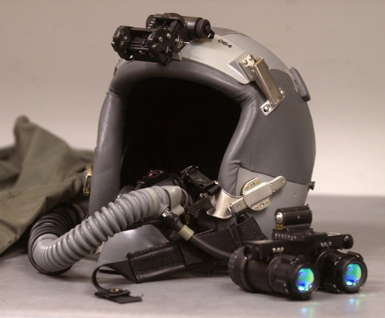 ** FILE ** A helmet and night vision goggles are displayed during a presentation at Hill Air Force Base, Utah in this March 26, 2003 file photo. (AP Photo/Douglas C. Pizac, File)