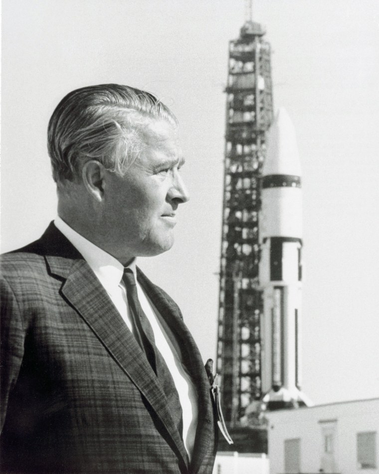 Dr. Wernher von Braun stands in front of a Saturn IB launch vehicle at Kennedy Space Flight Center. Dr. von Braun led a team of German rocket scientists, called the Rocket Team, to the United States, first to Fort Bliss/White Sands, later being transferred to the Army Ballistic Missile Agency at Redstone Arsenal in Huntsville, Alabama. They were further transferred to the newly established NASA/Marshall Space Flight Center (MSFC) in Huntsville, Alabama in 1960, and Dr. von Braun became the first Center Director. Under von Braun's direction, MSFC developed the Mercury-Redstone, which put the first American in space; and later the Saturn rockets, Saturn I, Saturn IB, and Saturn V. The Saturn V launch vehicle put the first human on the surface of the Moon, and a modified Saturn V vehicle placed Skylab, the first United States' experimental space station, into Earth orbit. Dr. von Braun was MSFC Director from July 1960 to February 1970.