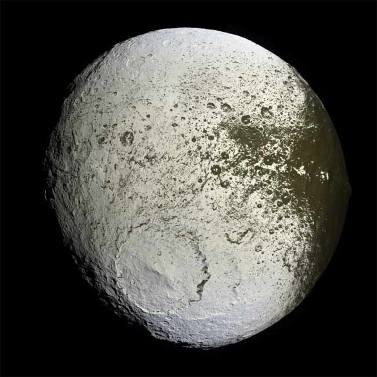 This false-color mosaic shows the entire hemisphere of Iapetus acquired by Cassini. The transition region between the dark leading and bright trailing hemispheres is visible along the right side of the image. 