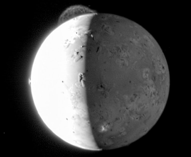 A composite image of Io, a moon of Jupiter, shows the Tvashtar volcano spewing gas high above Io's pockmarked surface.