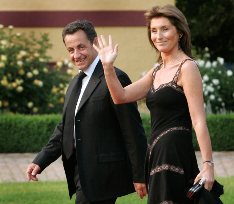 File photo of French President Sarkozy and his wife Cecilia arriving for an official dinner in Hohen Luckow