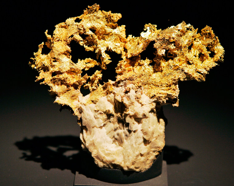 A piece of crystallized gold on quartz is on display at the \"Gold\" exhibit at the Louisiana State Museum at the Old U.S. Mint in New Orleans Tuesday, Oct. 16, 2007. The exhibit will open Saturday, and run though the end of the year. (AP Photo/Alex Brandon)