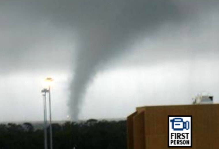 A msnbc.com reader captures a picture of a funnel cloud as it moves through Pensacola, Fla.