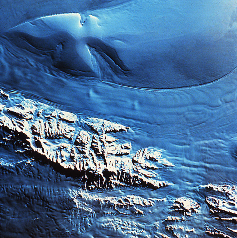 A digitally enhanced satellite image shows the Rutford Ice Stream flowing past the Sentinel Range of Antarctica’s Ellsworth Mountains.