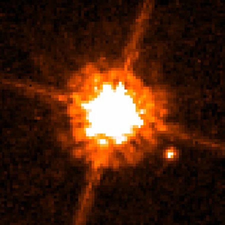 This NASA/ESA Hubble Space Telescope image shows one of the smallest objects ever seen around a normal star. Astronomers believe the object is a brown dwarf about 12 times more massive than Jupiter. Dubbed CHXR 73 B, it is the bright spot at lower right and orbits a red dwarf star called CHXR 73. 