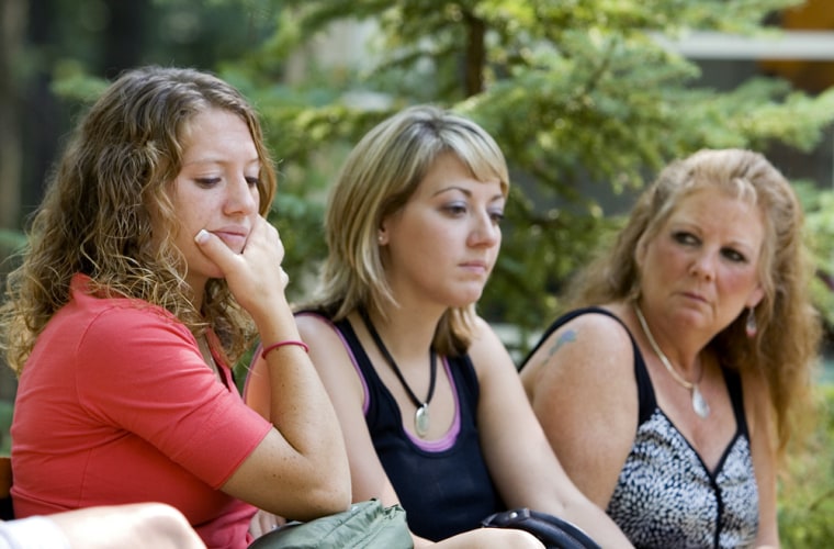 Olivia, left, 20, Lisa, 23, and Pam, right, 52,  talk about their recent reading at the Wonewoc Spiritualist Camp Wednesday, July 25, 2007, in Wonewoc, Wis. Visitors to the spiritualist camp come from around the country to get insight into their lives from the dearly departed. (AP Photo/Andy Manis)