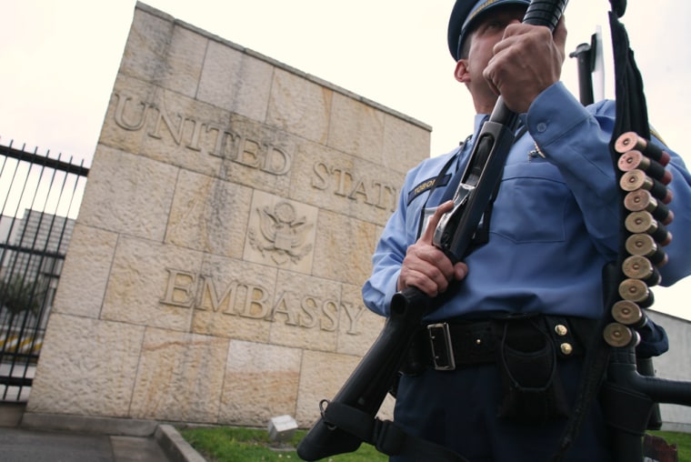 A security guard mans his post at the entrance of the U.S. Embassy in Bogota, Colombia, on Thursday.