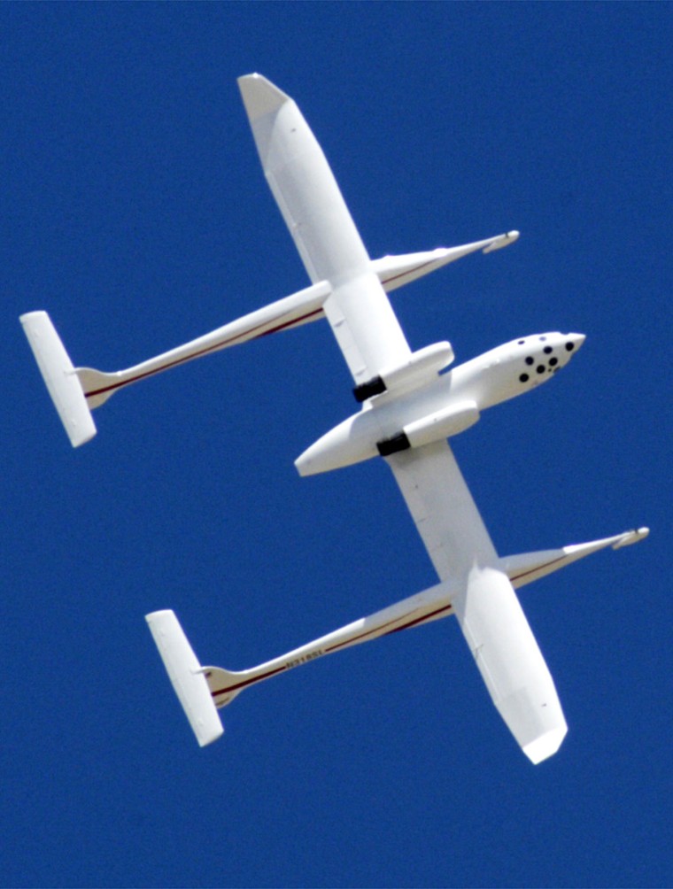 A privately-funded spacecraft is shown as it flies upside down above Mojave, Calif., after it was unveiled Friday, April 18, 2003. Famed aircraft designer Burt Rutan on Friday unveiled the rocket-powered spacecraft he hopes will carry three people on a suborbital flight into space and win a $10 million prize pledged to the first privately financed effort to do so. (AP Photo/Jamie Rector)