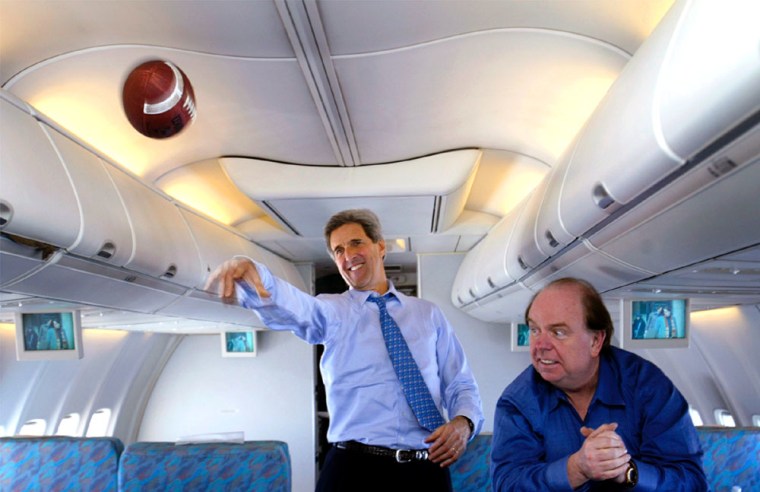 US DEMOCRATIC PRESIDENTIAL CANDIDATE JOHN KERRY THROWS A FOOTBALL ON CAMPAIGN PLANE
