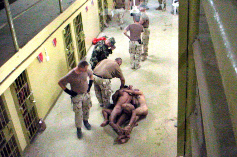 A GROUP OF NAKED MEN SEEN BOUND IN IMAGES RELEASED BY THE WASHINGTON POST