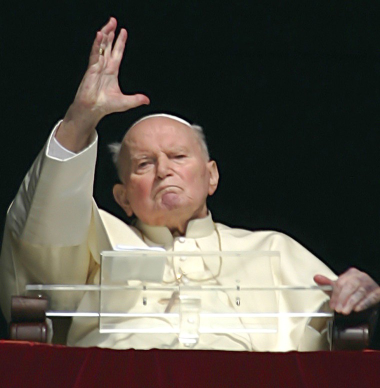 ** FILE ** Pope John Paul II gives his blessing from his studio window overlooking St. Peter's square at the Vatican, Wednesday, March 30, 2005. Pope John Paul II developed a high fever Thursday March 31, 2005  because of a urinary tract infection and was being treated with antibiotics at the Vatican, his spokesman said.  (AP Photo/Pier Paolo Cito)