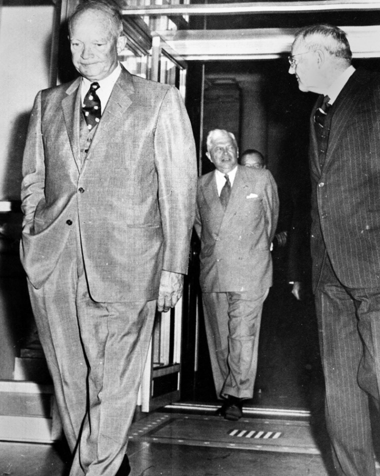 American President Dwight Eisenhower, left, tight lipped and solemn, walks into the North Portico of the White House, Washington, Oct. 29, 1956, during a break inthe emergency meeting to discuss the Middle East crisis. Secretary of State John Foster Dulles, right, and Secretary of Defence Charles Wilson, centre, follow the President. (AP Photo)