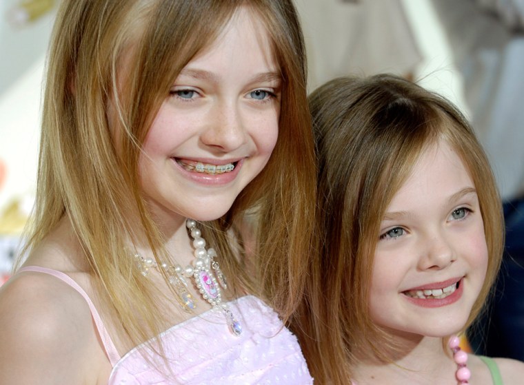 Dakota Fanning and her sister Elle pose together at the 2007 Kids' Choice Awards in Los Angeles