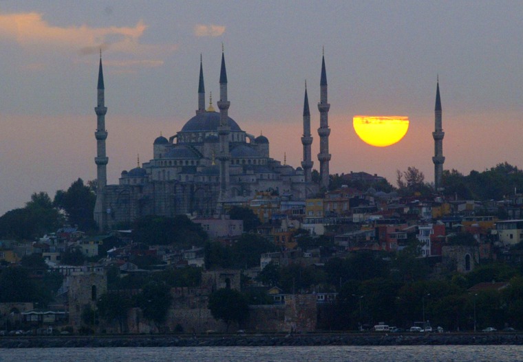 **  FILE  **  Sun sets over the Ottoman era Sultanahmet mosque, known as the Blue Mosque, in Istanbul, Turkey, in this  Wednesday, Sept. 21, 2005 file photo. The conservative group in the European Parliament will ask the assembly on Wednesday Sept. 28, to postpone the planned ratification of Turkey's customs union with the European Union. The EU governments issued a declaration warning that failure to recognize Cyprus could paralyze Turkey's entry talks with the EU, which are scheduled to start Oct. 3. (AP Photo/Osman Orsal)