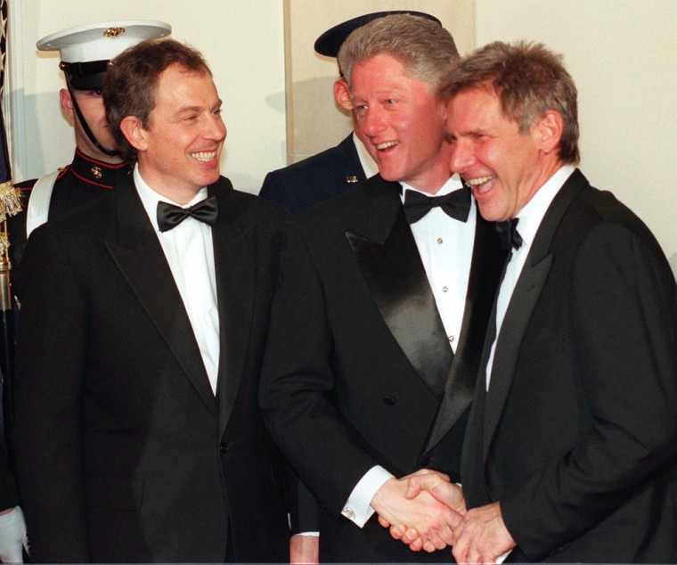 Actor Harrison Ford (R) is greeted by US President
