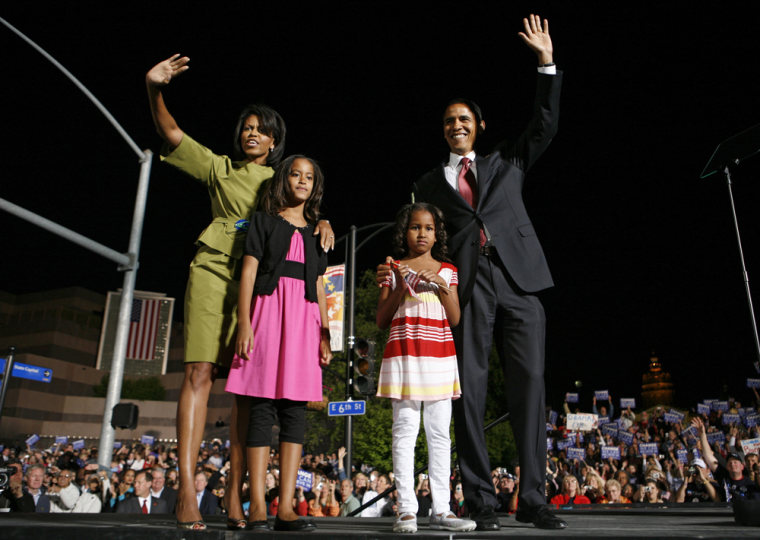 US Democratic presidential candidate Senator Barack Obama (D-IL) and his wife and daughters onstage at election night rally in Des Moines