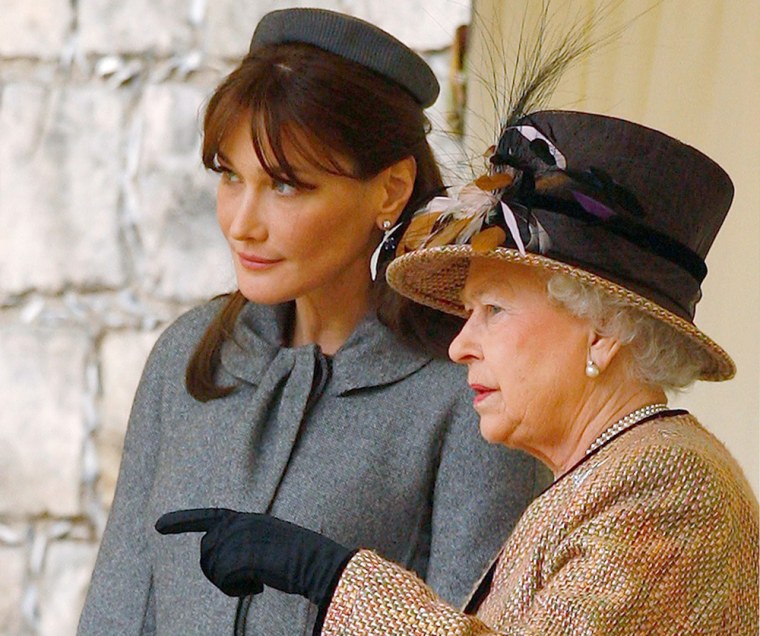 Britain's Queen Elizabeth II talks with France's first lady Carla Bruni-Sarkozy, during welcoming ceremonies at Windsor Castle in Windsor, England, Wednesday March 26, 2008, at the start of a two-day State Visit to Britain by French President Nicolas Sarkozy.(AP Photo/Kieran Doherty, pool)