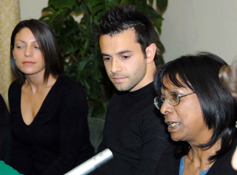 Arline, mother of Meredith Kercher, the British student killed in Italy last November in Perugia, central Italy, answers newsmen questions flanked by Meredith's sister Stephanie, left, and brother Lyle, during a press conference in Perugia Friday, April 18, 2008. Earlier they were before a court hearing in the case, and said they are \"happy with the progress made by the investigation'' into the death of the 21-year-old student from Leeds University in England. (AP Photo/Leonetto Medici)