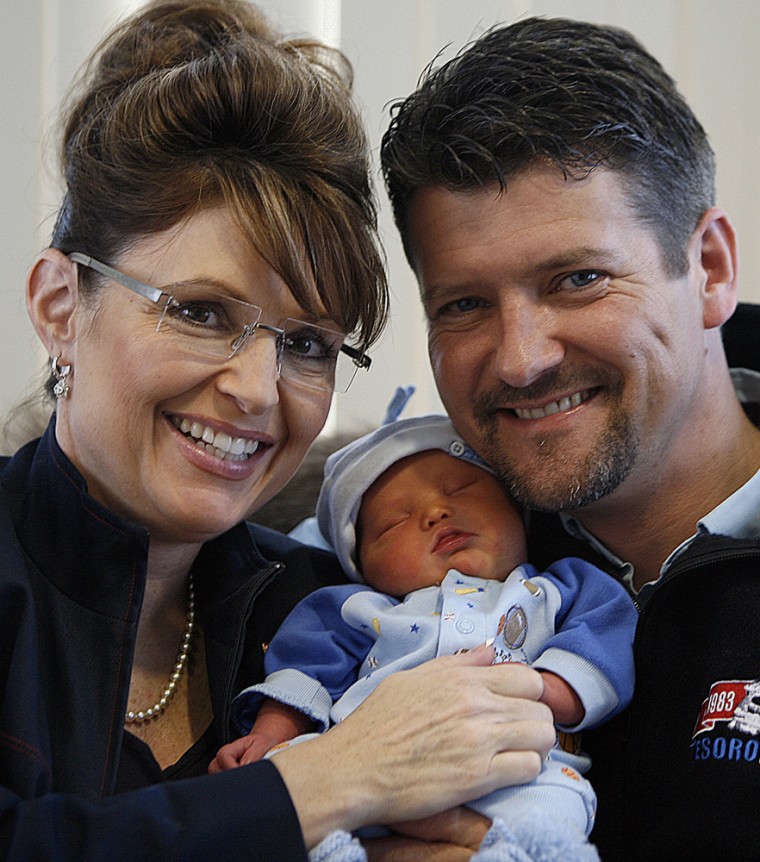 Alaska Governor Sarah Palin, left, and her husband Todd Palin hold their baby boy Trig in Anchorage, Alaska Wednesday, April 23, 2008. Palin's fifth child was born with Down syndrome, a genetic abnormality that impedes physical, intellectual and language development. (AP Photo/Al Grillo)