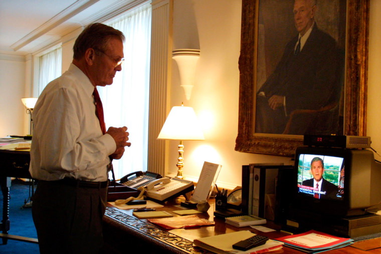 Donald Rumsfeld Watches Television In His Office