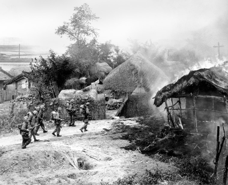 American paratroopers comb over a village near Sunchon, North Korea on Oct. 20, 1950 during the Korean War.  (AP Photo/Max Desfor)