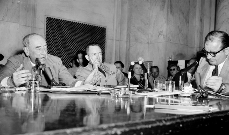 ** FILE ** Special Army Counsel Joseph Welch, left, lashes Sen. Joseph McCarthy, R-Wis., right,  as a \"reckless and cruel\" man after McCarthy threw a charge of communist association at a member of Welch's law firm during testimony at the Army-McCarthy hearings in this June 9, 1954 file photo in Washington. Lt. Col. John Murray is at center. The hearings of Spring 1954 have been called \"the first great made-for-TV political spectacle.\" McCarthy, who rose to prominence through a shrewd use of television for his scripted news conferences and speeches, was, ironically, about to be undone by TV exposure beyond his control. (AP Photo/File)
