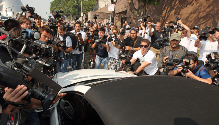 Image: Photographers mob Britney Spears' car.