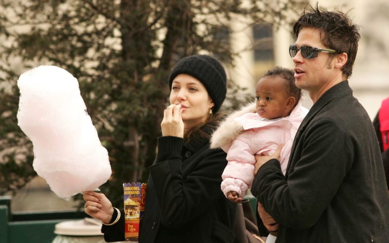 PARIS: Brad and Angelina enjoy a Merry-go-round.