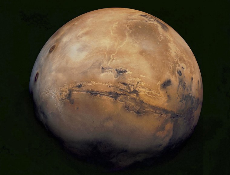 This mosaic of Mars is a compilation of images captured by the Viking Orbiter 1. The center of the scene shows the entire 2,500-mile Valles Marineris canyon system, which is five times as long as the Grand Canyon. The image is part of \"MARS 2K4,\" an exhibit on display at the National Geographic Museum in Washington from Jan. 22 through April 25, 2004. (AP Photo/NASA, USGS)