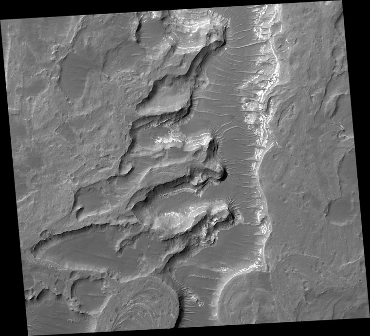 Scientifically, perhaps the most important result from use of the Mars Orbiter Camera on NASA's Mars Global Surveyor during that spacecraft's extended mission has been the discovery and documentation of a fossil delta. The feature is located in a crater northeast of Holden Crater, near 24.0 degrees south latitude, 33.7 degrees west longitude. Since the announcement of the discovery of the delta in November 2003, the International Astronomical Union has provided a provisional name (pending final approval) for the crater in which the landforms occur. The crater has been named Eberswalde, for a town in Germany.   This image offers a higher-resolution view of a portion of the fossil delta than any seen earlier. North is up. At the bottom of the frame, the image includes the north end of a looping, inverted, meandering channel. The image covers an area of about 3 by 3 kilometers (1.9 x 1.9 miles). It was produced using a technique called \"compensated pitch and roll targeted observation,\" in which the rot