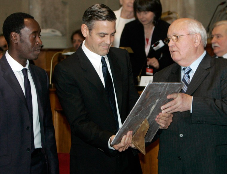 U.S. actors Clooney and Cheadle are presented the 2007 Peace Summit Award by former Soviet leader Gorbachev in Rome