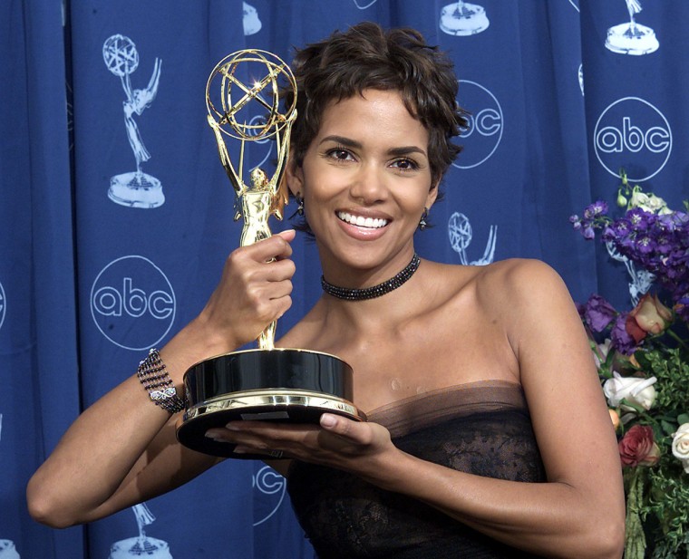 Actress Halle Berry holds her trophy for the \"Lead