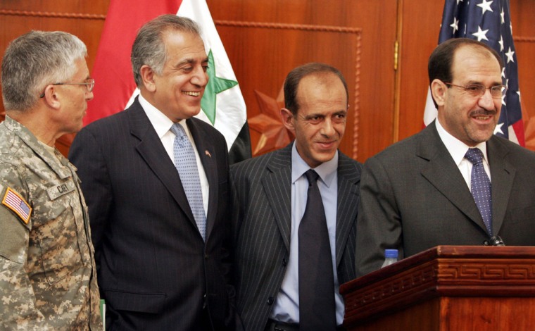 Iraqi PM stands with US Ambassador to Iraq and top US commander in Iraq during a news conference in Baghdad
