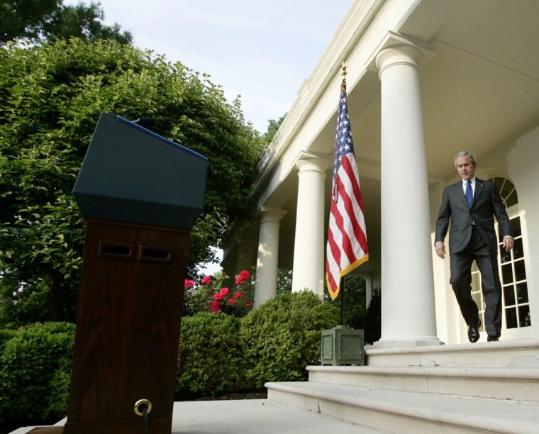 US President Bush walks to Rose Garden to make remarks on death of Abu Musab al-Zarqawi in Washington