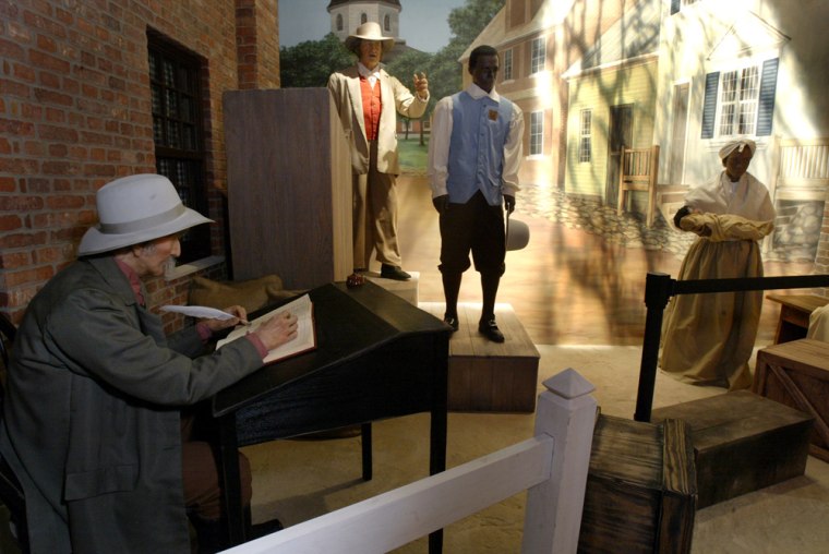 Mannequins representing the a slave auction are shown in the exhibit \"And Still We Rise\" at the Charles H. Wright Museum of African American History in Detroit, Feb. 1, 2005.  (AP Photo/Paul Sancya)