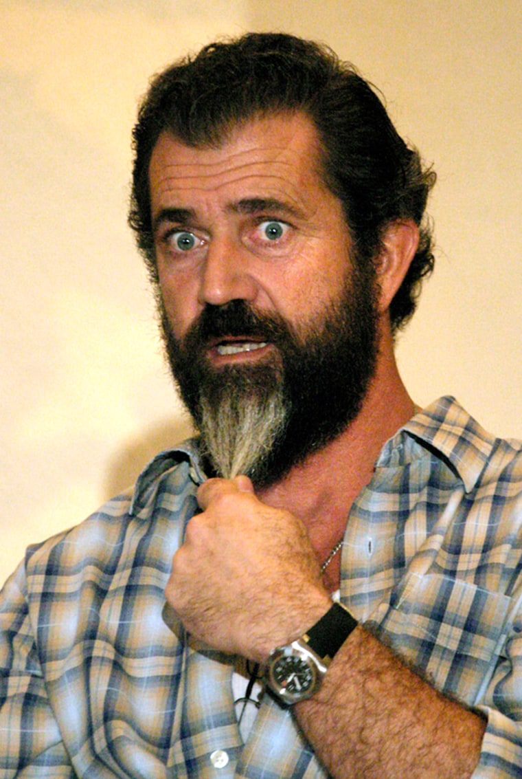 Movie actor and director Mel Gibson, pulls on his beard during a news conference held in Veracruz, Mexico, Friday, Oct. 28, 2005. Gibson announced the shooting of his new film called Apocalypto spoken in an obscure mayan dialect and set 500 years ago in Central America. (AP Photo/David Hernandez)