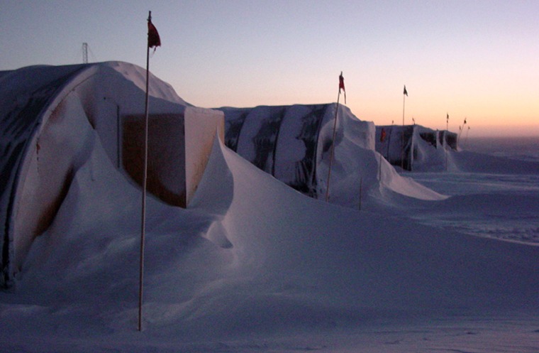 Snow drifts against a row of semicircular structures known as "Jamesways" at a U.S. Antarctic base. Such huts could serve as models for a prototype lunar habitat.