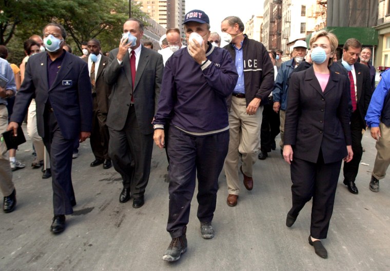 New York City Mayor Rudolph Giuliani (C) leads US
