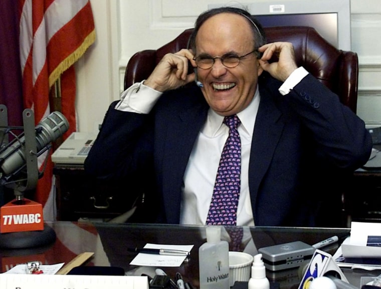 New York City Mayor Rudolph Giuliani laughs as he