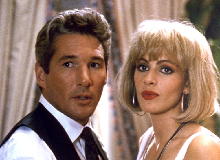 Gere stars opposite Julia Roberts in the wildly popular 1990 film \"Pretty Woman.\" Roberts plays a prostitute who falls in love with powerful but lonely CEO Edward Lewis (Gere). The film grossed more than $178 million in the U.S. alone and was the fourth-highest-grossing film of that year (after \"Home Alone,\" \"Dances With Wolves\" and \"Ghost\").