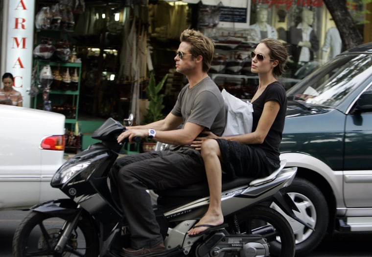Brad Pitt and Angelina Jolie spent Thanksgiving, Thursday, Nov. 23, 2006  cruising on a motorbike while touring Ho Chi Minh City, Vietnam.  Prior to arriving in Vietnam, the couple made a surprise visit to Cambodia where they visited a former Khmer Rouge death camp, now a genocide museum. Jolie has an adopted son from Cambodia, 5-year-old Maddox. ( AP Photo)