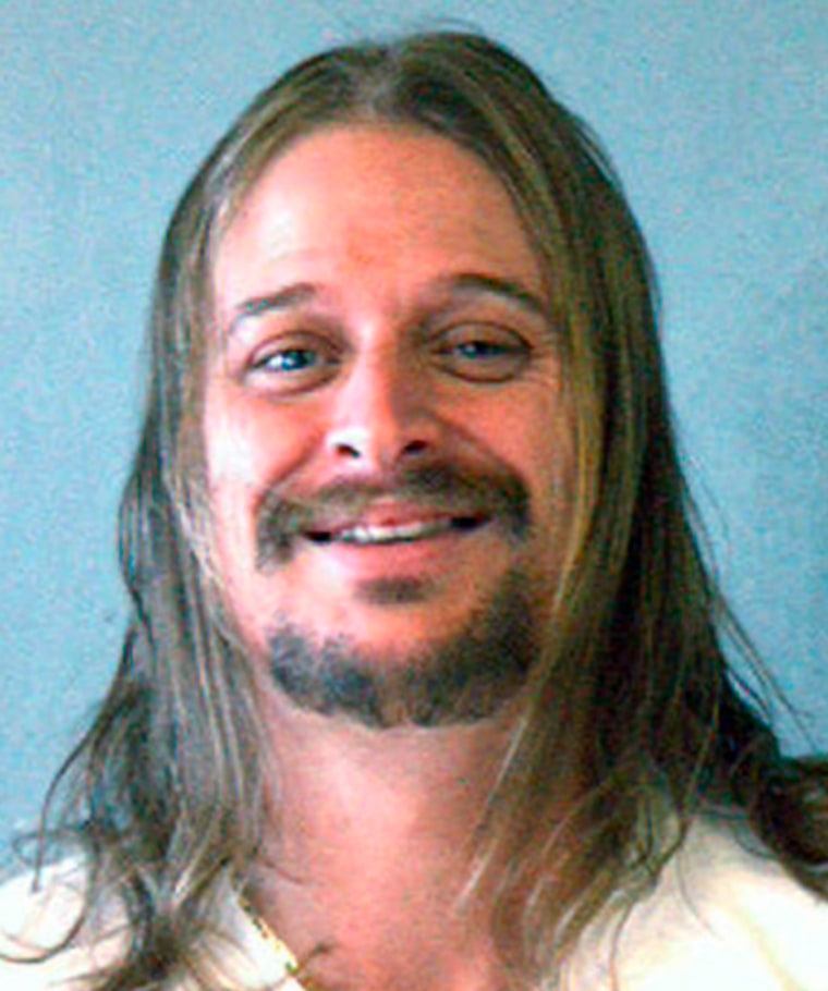 A handout photo shows a police mug shot of musician Kid Rock following an altercation at a Waffle House in Dekalb County