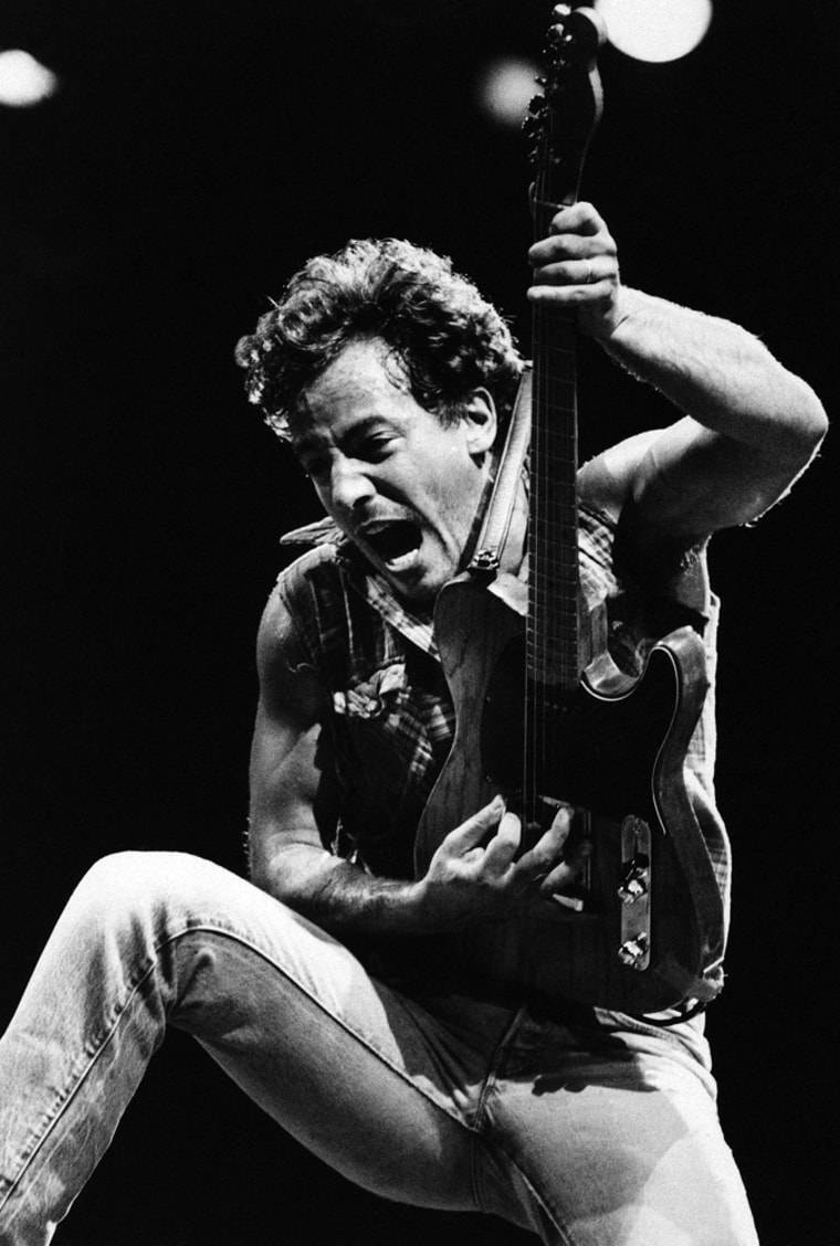 Rock star Bruce Springsteen belts out a song for fans at a concert at the Coliseum in Los Angeles, Sept 29,1985. (AP Photo/Lennox Mclendon)