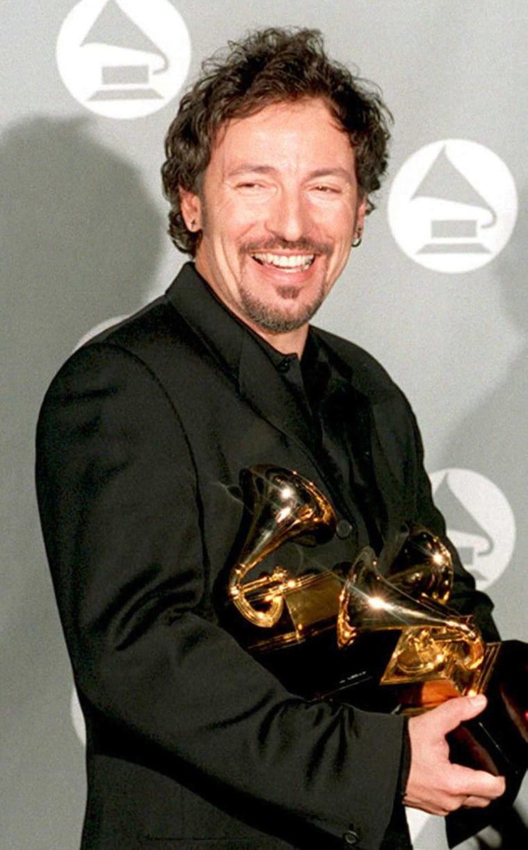 Singer Bruce Springsteen holds his four Grammy awa