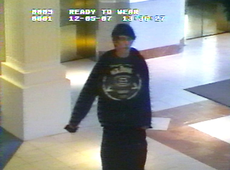 Image: image taken from a video surveillance camera and released by the Omaha Police Department Friday Dec. 7, 2007 shows gunman Robert A. Hawkins walking into the Westroads Mal